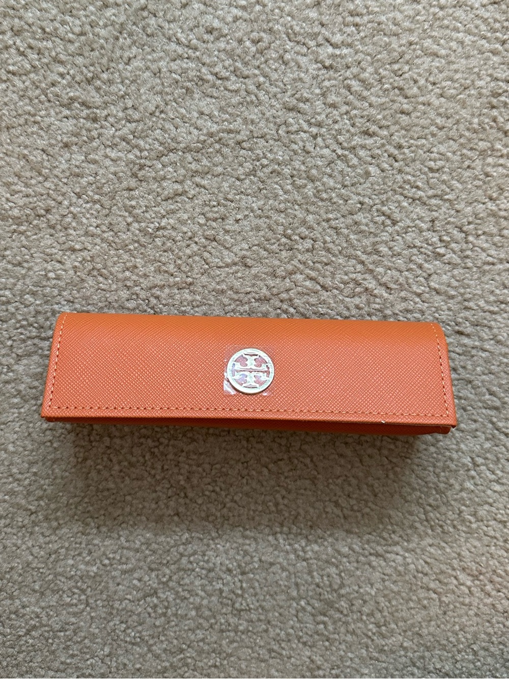 Tory Burch orange leather case